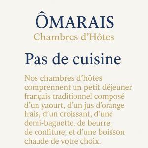 a sign that readsratesrates phones reass de cuisine at Ômarais Guest House in Paris