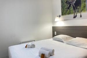 Ένα ή περισσότερα κρεβάτια σε δωμάτιο στο Villa Canada - Domaine Le Sherwood +5 φωτογραφίες