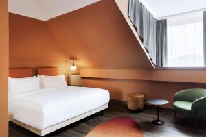 Łóżko lub łóżka w pokoju w obiekcie Mayburg Salzburg, a Tribute Portfolio Hotel