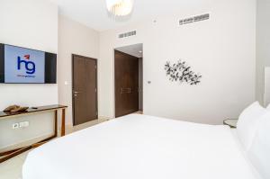 Postel nebo postele na pokoji v ubytování HomesGetaway - Sophisticated 3BR with Maids Room in Downtown