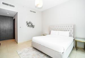 Postel nebo postele na pokoji v ubytování HomesGetaway - Sophisticated 3BR with Maids Room in Downtown