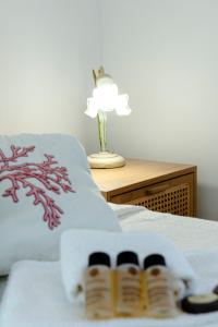 Postel nebo postele na pokoji v ubytování Villino dei Coralli