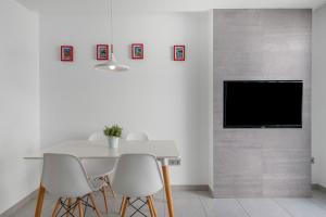 Μια τηλεόραση ή/και κέντρο ψυχαγωγίας στο Apartamento Princesa Teguise