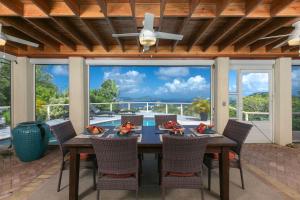 an outdoor dining room with a table and chairs at Cielo Vista Villa 3 BDRM Sleeps 6 Heavenly View in Cruz Bay +30 photos