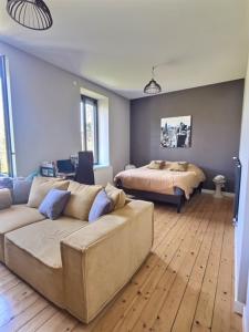 Posteľ alebo postele v izbe v ubytovaní Le Moulin Chambres hôtes