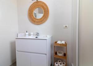 a bathroom with a sink and a mirror on the wall at Global Properties, Les Villetes - Magdalena in Moncófar +38 photos