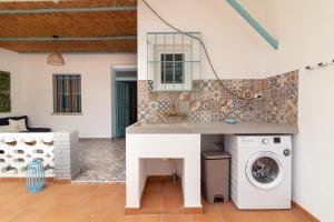 a kitchen with a washing machine in a house at Global Properties, Les Villetes - Magdalena in Moncófar