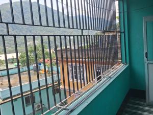 a balcony with a view of a building at Hotel mountain rangpo in Jāmb