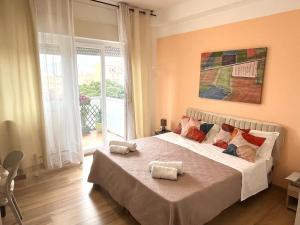 a bedroom with a large bed with two towels on it at LeAlbe di Sicilia in Palermo +267 photos