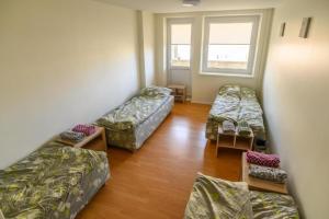 Postel nebo postele na pokoji v ubytování Senamiesčio hostelis