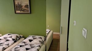 A bed or beds in a room at Sasso-студио 3