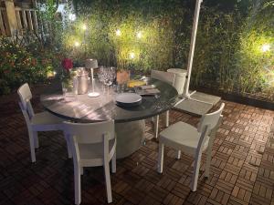a table and chairs sitting on a patio at Alessandra House in Grottammare