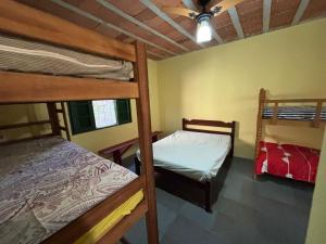 Postel nebo postele na pokoji v ubytování Pousada Duas irmãs
