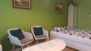 A bed or beds in a room at Sasso-студио 3