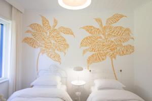 Ένα ή περισσότερα κρεβάτια σε δωμάτιο στο GuestReady - Unique Lake Casa do Gar