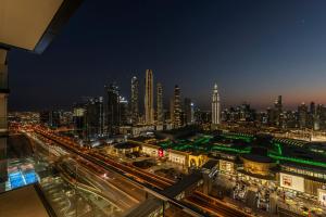 Nespecifikovaný výhled na destinaci Dubaj nebo výhled na město při pohledu z apartmánu