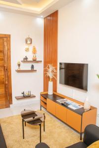 TV a/nebo společenská místnost v ubytování Appartements meublés mpita
