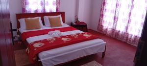 Letto o letti in una camera di Stay Logi Nanuoya