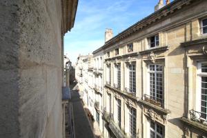 a view of an alley between two buildings at Appart Hypercentre - Le Teulere in Bordeaux