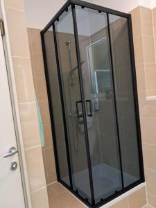 a shower with a glass door in a bathroom at Golden Panorama in Novalja +16 photos