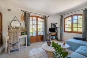 TV a/nebo společenská místnost v ubytování Magnifique Appartement - Mas Serens