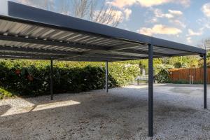 a black metal pavilion in a parking lot at Twelve on Arum in Somerset West