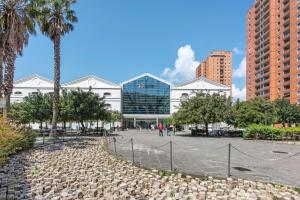 a group of buildings in a city with palm trees at Domus Superba - Genova in Genova