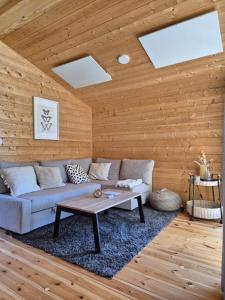 a living room with a couch and a table at 405-Tiny House Ruhr in Bleckede