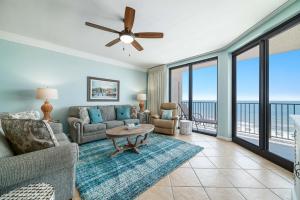 a living room with a couch and a table at Phoenix X Unit 803 in Orange Beach