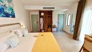 Postel nebo postele na pokoji v ubytování VILLA MARGARIT Boutique Hotel