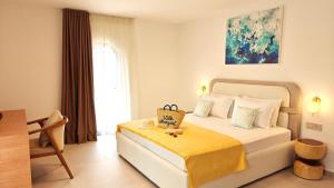 Postel nebo postele na pokoji v ubytování VILLA MARGARIT Boutique Hotel