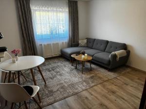 a living room with a couch and a table at Wohnung in Reelkirchen mit 1 Schlafzimmer in Blomberg