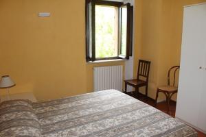 A bed or beds in a room at Sabina Trilo Sirolo, in centro con posto auto