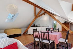 a kitchen and dining room with a table and chairs at Gallushof in Lauterbach