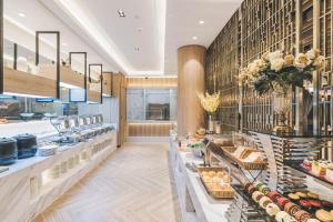 a bakery with a buffet line with food at Atour Hotel Shanghai Anting in Shanghai +34 photos