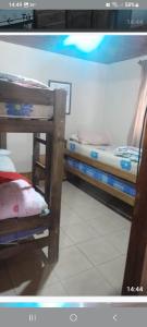 a room with two bunk beds in a room at Cabañas Las Dunas in El Nihuil +7 photos