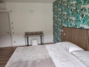Postel nebo postele na pokoji v ubytování B&B El Rocol