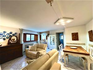 a living room with a couch and a table at Villa Maria Grazia in Lucca +25 photos