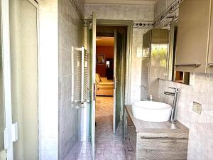 a bathroom with a sink and a mirror at Villa Maria Grazia in Lucca