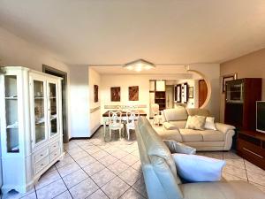 a living room with a couch and a table at Villa Maria Grazia in Lucca