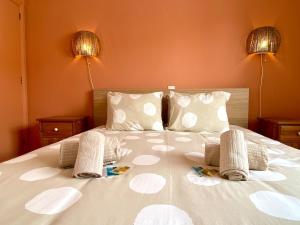 a bed with two pillows and two lamps on it at Portugal Secret 2 by CORAL - Townhouse rooftop in Portimão