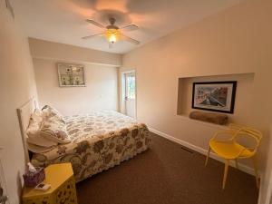 a bedroom with a bed and a ceiling fan at Lake Huron Lodge in Lexington