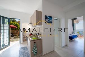a kitchen with a sink and a counter at Casa Angelina in Conca dei Marini