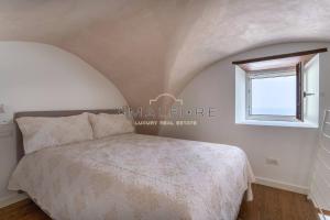 Кровать или кровати в номере Lionetti Suite House