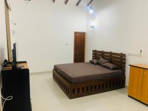Postel nebo postele na pokoji v ubytování KNR Resort