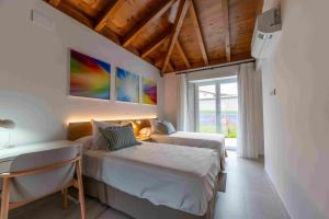 Ένα ή περισσότερα κρεβάτια σε δωμάτιο στο Reverence Villas Carballal +23 φωτογραφίες
