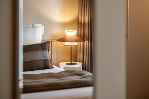 Postel nebo postele na pokoji v ubytování Hôtel L'Adresse - Entièrement rénové
