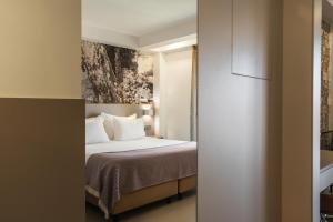 Postel nebo postele na pokoji v ubytování Serra d'Aire Boutique Hotel - SA Hotels
