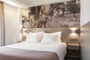 Postel nebo postele na pokoji v ubytování Serra d'Aire Boutique Hotel - SA Hotels