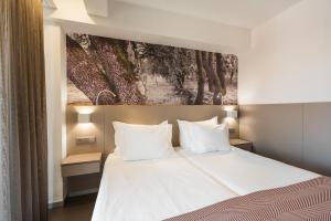 Postel nebo postele na pokoji v ubytování Serra d'Aire Boutique Hotel - SA Hotels